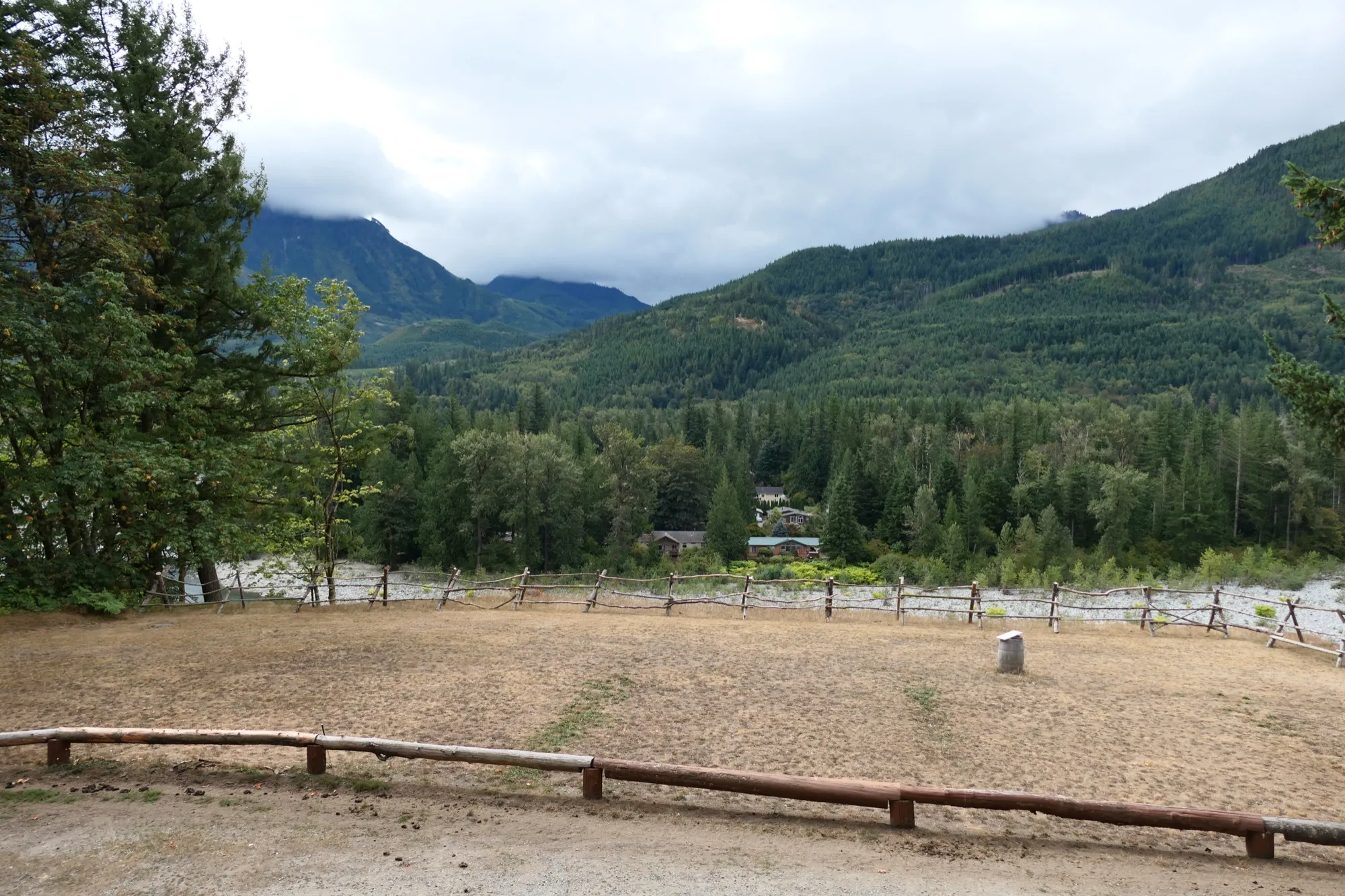 The riding arena overlooking the river valley, with the Cascade foothills rising behind